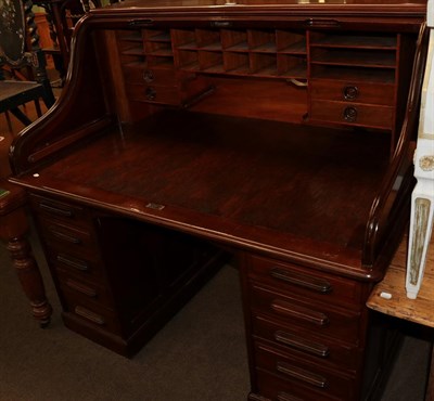 Lot 520 - A roll top desk