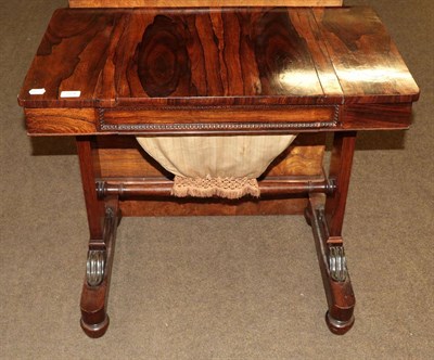 Lot 524 - A Regency rosewood work and games table