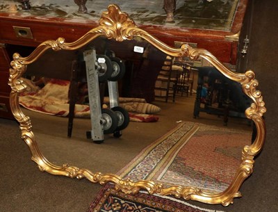 Lot 529 - A 20th century gilt mirror with shell moulded pediment