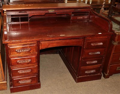 Lot 530 - An early 20th century mahogany roll top desk with brass plaque impressed Feige Desk Company, USA