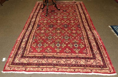 Lot 533 - Iranian village carpet, the strawberry field of flower heads enclosed by multiple narrow...