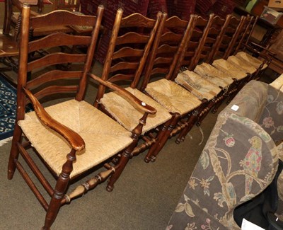 Lot 547 - A set of eight (6+2) Lancashire ladder back chairs, 19th century, rush seats (8)