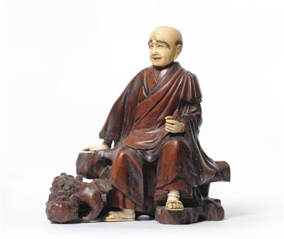 Lot 199 - A Japanese Carved Wood and Ivory Mounted Figure Group as an Ascetic, Meiji period (1868-1912),...