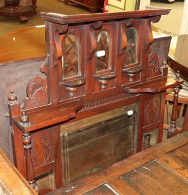 Lot 563 - A figured mahogany demi-lune two shelf cupboard and a Victorian walnut over-mantel mirror (2)