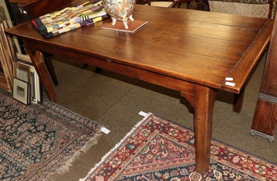 Lot 564 - An oak plank top farmhouse table, cleated ends, square tapered legs