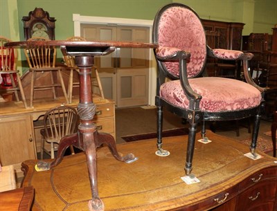 Lot 572 - A George III mahogany tilt-top tripod table with a 19th century open armchair