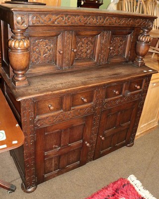 Lot 578 - An early 20th century carved oak court cupboard