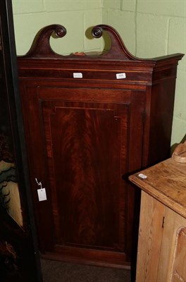 Lot 588 - A George III mahogany wall hanging corner cupboard