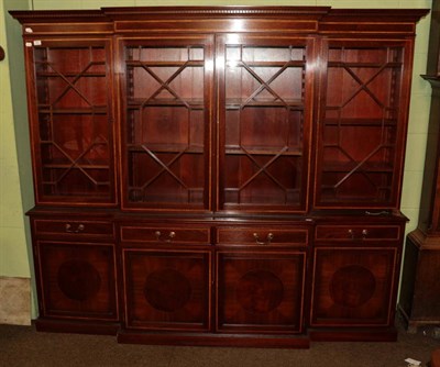 Lot 591 - A reproduction satin wood inlaid mahogany astragal glazed break front bookcase, possibly Bevan...