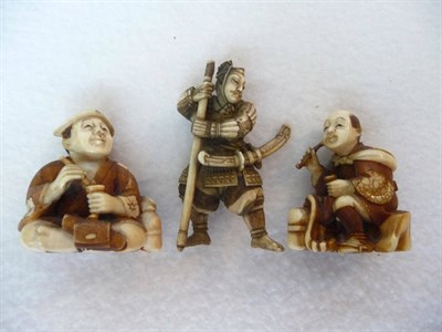 Lot 202 - A Japanese Carved and Stained Ivory Netsuke, circa 1900, as a traveller seated on a tree stump...