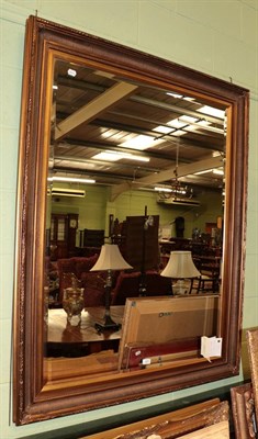 Lot 600 - Reproduction gilt bevel glass mirror with moulded frame, 142cm by 112cm