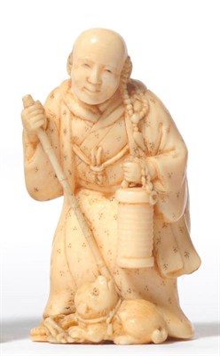 Lot 203 - A Japanese Elephant Ivory Netsuke, circa 1880, as a monk, with a string of rosary beads around...