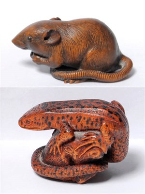 Lot 216 - A Carved Wood Okimono of a Lizard, by Michael Webb, 1986, depicted as sunbathing on a tree...