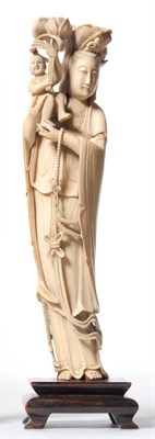 Lot 224 - A Chinese One Piece Carved Elephant Ivory Figure of a Confucian Sage, circa 1930, the bearded...