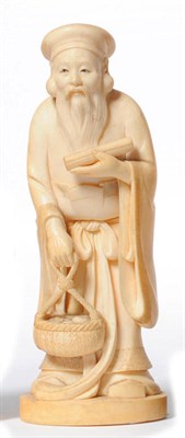 Lot 226 - A Japanese One Piece Carved Elephant Ivory Figure of a Daoist Sage, Meiji period (1868-1912),...