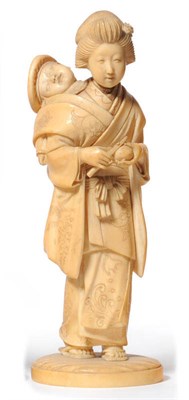 Lot 227 - A Japanese One Piece Carved Ivory Figure of a Mother and Child, Meiji period (1868-1912), she...