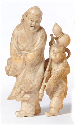 Lot 230 - A Japanese One Piece Carved Elephant Ivory Figure Group, late Meiji period (1868-1912), as a...