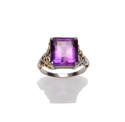 Lot 254 - An Arts and Crafts Amethyst Ring, attributed to Bernard Instone, the step cut amethyst within white