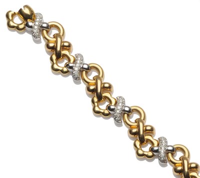 Lot 260 - An 18 Carat Two Colour Gold Diamond Set Bracelet, by Garrard & Co., a series of yellow gold...