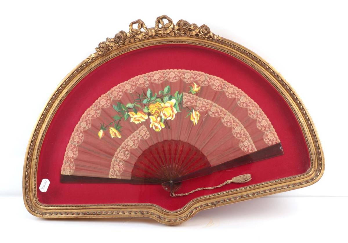 Lot 2012 - A Large and Decorative Framed Late 19th Century Fan, blousy yellow roses painted on a pale...