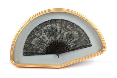 Lot 2015 - A Circa 1900 Black Handmade Lace Fan, most likely Chantilly, the lace of floral design, the...