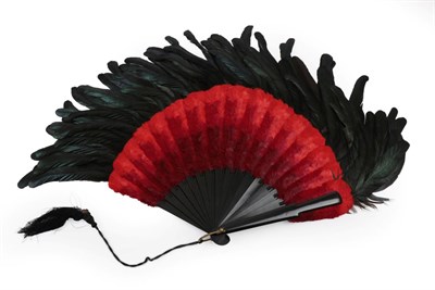 Lot 2038 - A Dramatic Feather Fan, late 19th century, the monture of wood painted black, the central body...