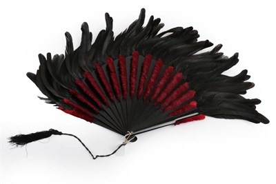 Lot 2038 - A Dramatic Feather Fan, late 19th century, the monture of wood painted black, the central body...