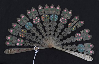 Lot 2045 - A Good Early 19th Century Horn Brisé Fan, barrel rivet, the sticks carved and pierced and...