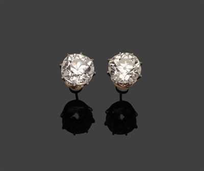 Lot 268 - A Pair of Old Cut Diamond Solitaire Stud Earrings, each diamond held in a white claw setting,...