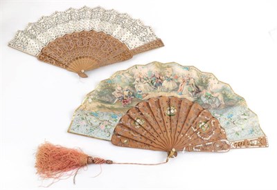 Lot 2066 - Two 1850's to 1860's Wood Fans, both carved and pierced and clouté in silver. The monture on...