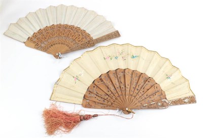 Lot 2066 - Two 1850's to 1860's Wood Fans, both carved and pierced and clouté in silver. The monture on...