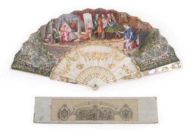 Lot 2069 - Madonna and Child: A Mid-19th Century Mother-of-Pearl Fan, with elaborate monture, being carved and