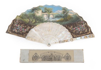 Lot 2069 - Madonna and Child: A Mid-19th Century Mother-of-Pearl Fan, with elaborate monture, being carved and