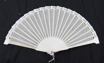 Lot 2073 - A Bone Fan, of cream gauze embroidered with silver spangles of various shapes, the monture with...