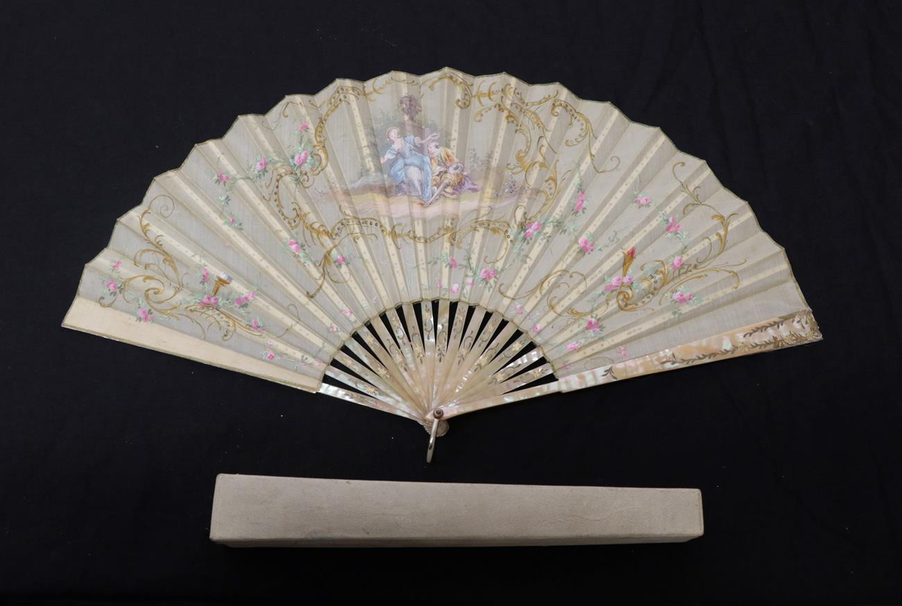 Lot 2078 - A Circa 1900 Silk Fan, the cream silk leaf mounted on pink Mother-of-pearl sticks, attractively...