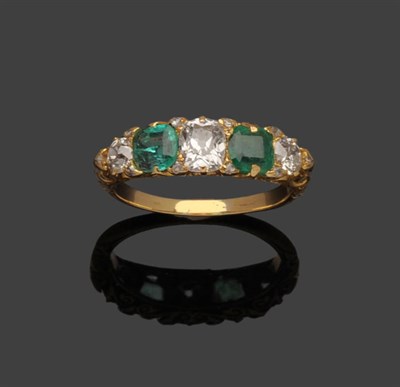 Lot 272 - An Emerald and Diamond Ring, a cushion cut diamond and two old brilliant cut diamonds alternate...