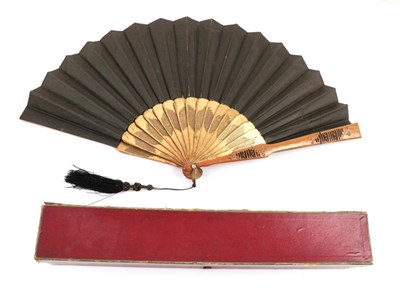 Lot 2092 - A Circa 1880's Black Silk Fan, mounted on black wood sticks, painted with delicate lilac...