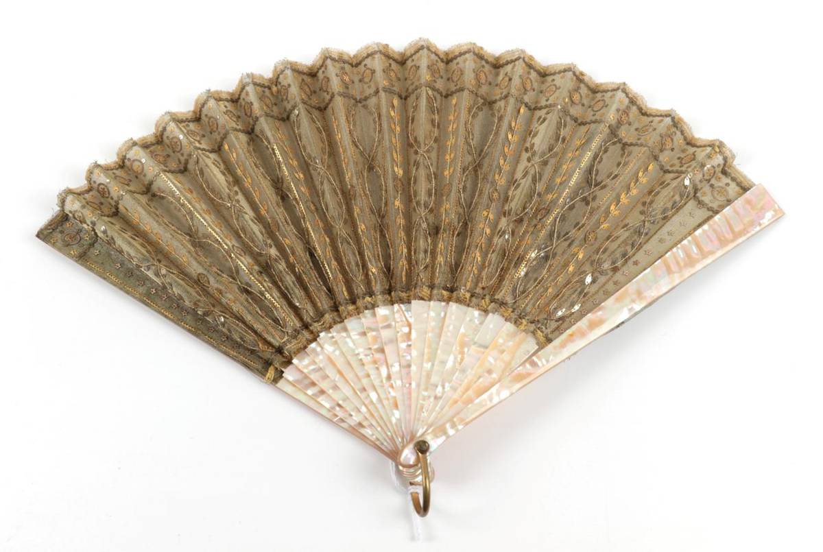 Lot 2094 - Gold Spangled Lamé: A First Quarter 20th Century Mother-of-Pearl Fan, the leaf a strong gold...