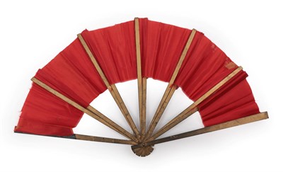 Lot 2108 - A Trick or Magician's Fan, the wood sticks mounted with a shiny red fabric. Constructed in such...