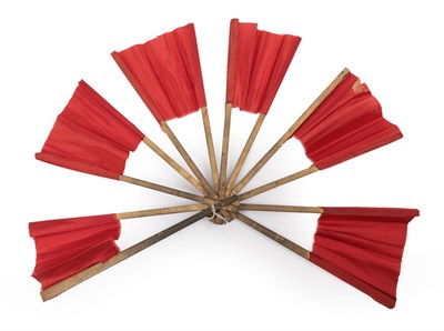 Lot 2108 - A Trick or Magician's Fan, the wood sticks mounted with a shiny red fabric. Constructed in such...