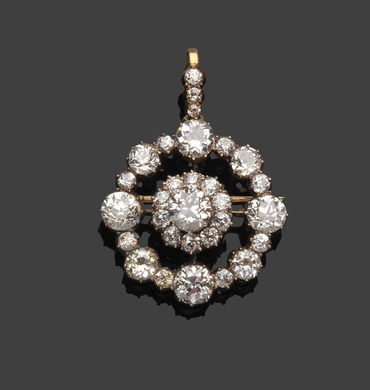 Lot 274 - A Victorian Diamond Target Brooch/Pendant, the old cut diamonds arranged as a central cluster...