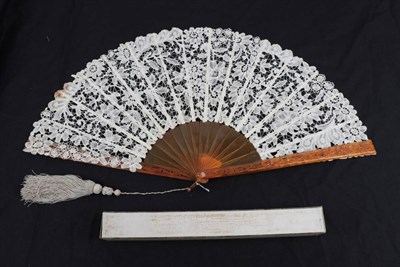 Lot 2120 - A Large Late 19th Century Brussels Bobbin Lace Fan, the guipure lace quite open with large flowers.