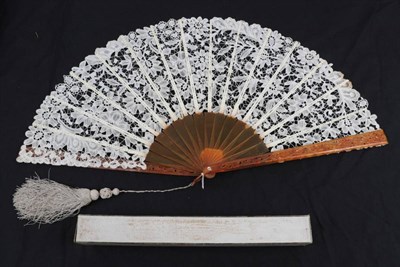 Lot 2120 - A Large Late 19th Century Brussels Bobbin Lace Fan, the guipure lace quite open with large flowers.