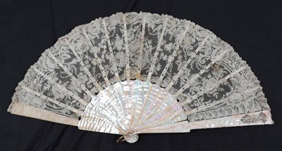 Lot 2127 - A Large Circa 1880's Brussels Point De Gaze Needle Lace Fan, the leaf mounted on good pink...