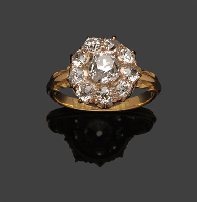 Lot 276 - A Diamond Cluster Ring, an old cut diamond within a border of nine smaller, in white claw...