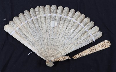 Lot 2207 - A Chinese Carved Ivory Brisé Fan, circa 1830-1850, Qing Dynasty, both guards heavily carved...