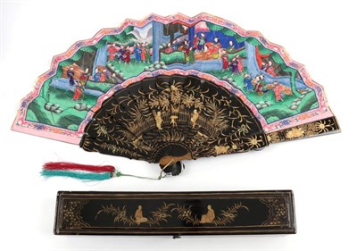 Lot 2208 - A Boxed Chinese Mandarin Fan, Qing Dynasty, the monture of wood lacquered in black and gold....
