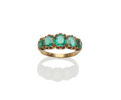 Lot 287 - A Late 19th Century Emerald Five Stone Ring, the graduated cushion cut emeralds in a yellow...