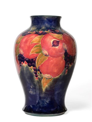 Lot 3531 - William Moorcroft (1872-1945): A Pomegranate Pattern Baluster Vase, on a blue/green ground,...