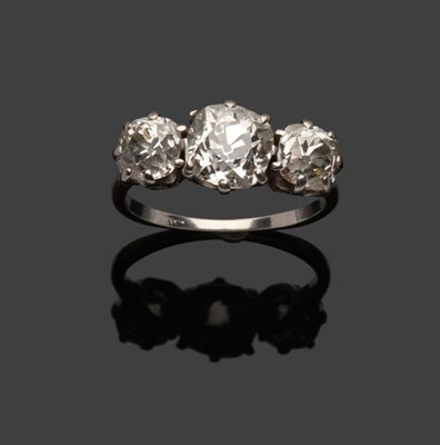 Lot 301 - A Diamond Three Stone Ring, the graduated old cut diamonds in white claw settings, to a tapered...